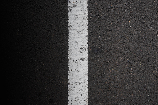 Close-up view of the black asphalt. Black asphalt for texture background