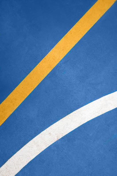 istock White and yellow stripes on the blue floor 1868888988