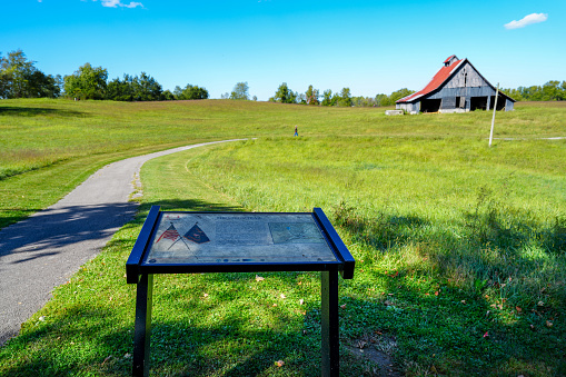 Historic Civil War battlefield in Richmond Kentucky with informational sign and barn