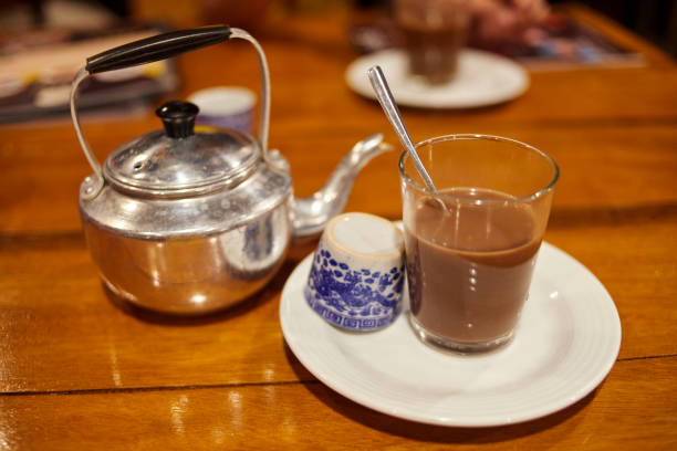 istock Glass cup of hot coffee on table 1868922685