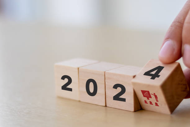 istock Training and knowledge sharing concept. Workforce and team training plan in 2024.  Wooden cubes with 2024 and training symbols on smart background and copy space. Training program planning by HRM. 1868953813