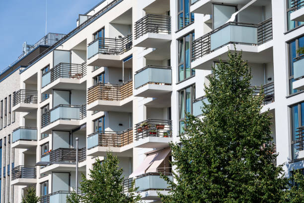 istock Apartment building with green trees 1869004072