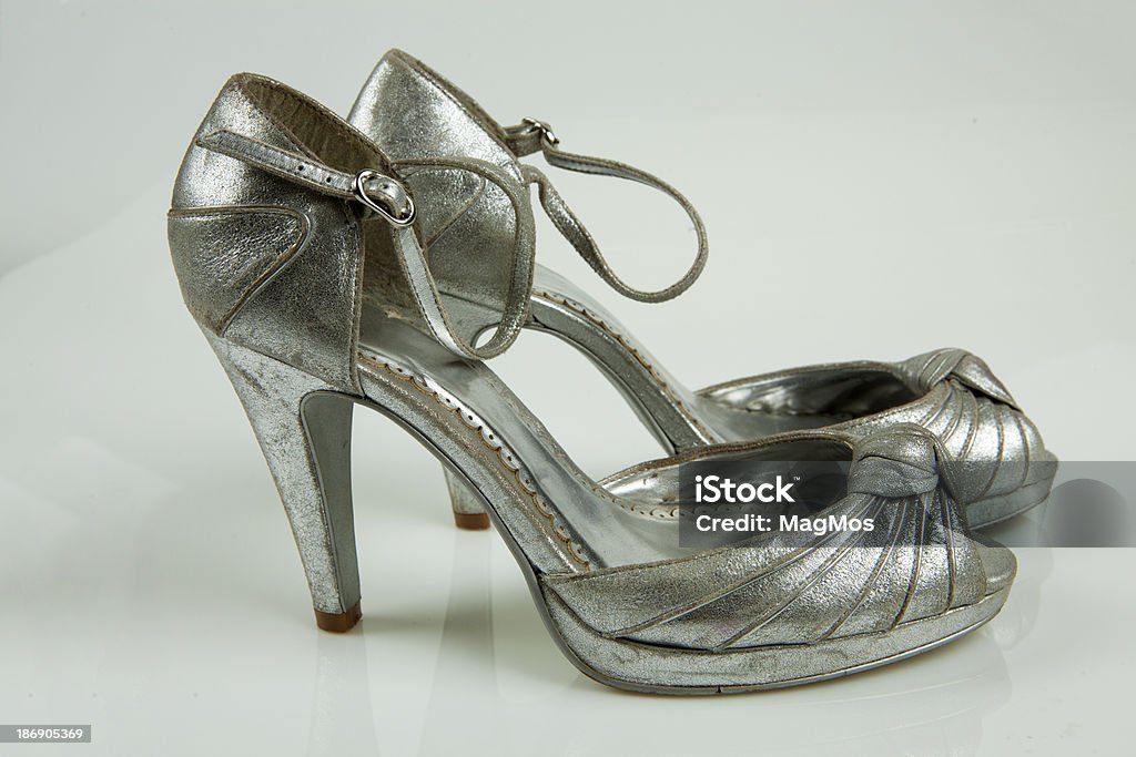 Silver high-heeled shoes Silver high-heeled shoes on a white background Beauty Stock Photo