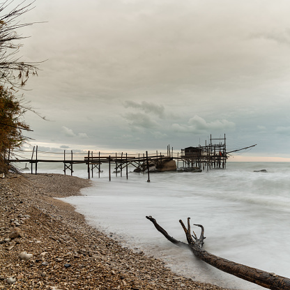 A view of the Trabocco Punto le Morge pile dwelling on an overcast an rainy day on the Costa dei Trabocchi in Italy