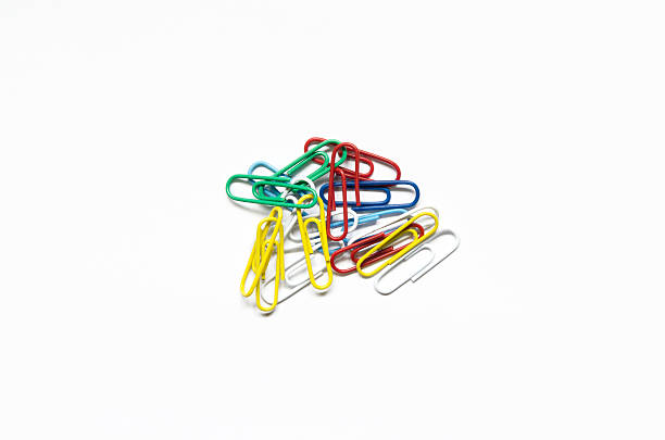 colored paper clips isolated on white background stock photo