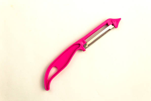 istock vegetable and fruit peeler on a white background. 1869102997