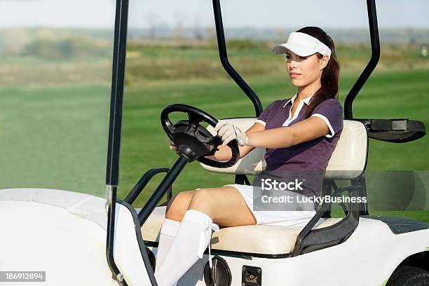 Female Golfer Driving Golf Cart Stock Photo - Download Image Now - Activity, Car, Cart