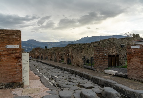 Pompei, Italy - 25 November, 2023: tyoical city street and houses in the ancient Roman town of Pompeii