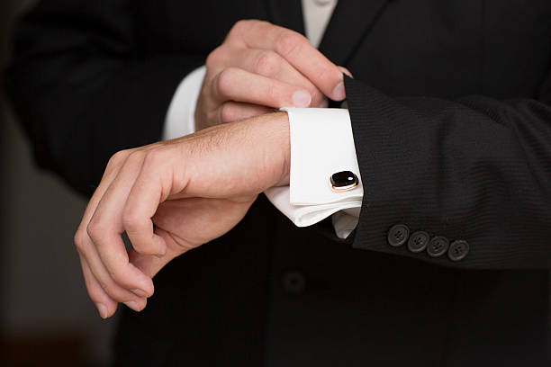 istock Wedding details, cufflinks, elegant male suit and hands 186913741