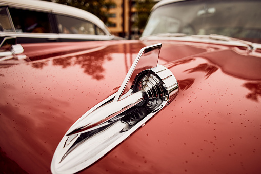 Den Bosch, The Netherlands – May 14, 2017: Rear end of a classic pink Cadillac fifties car in Den Bosch, The Netherlands