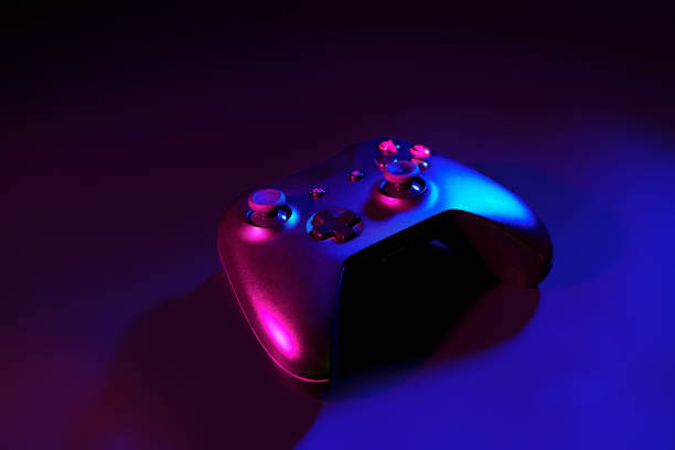 istock Gaming joystick on black background in neon light 1869167172