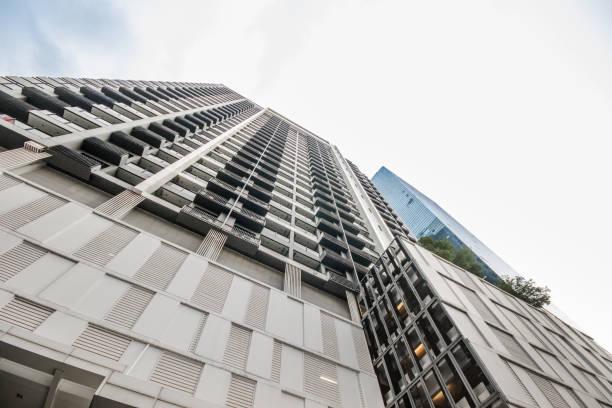 istock High-rise residential condo against the blue sky, view from below 1869168213