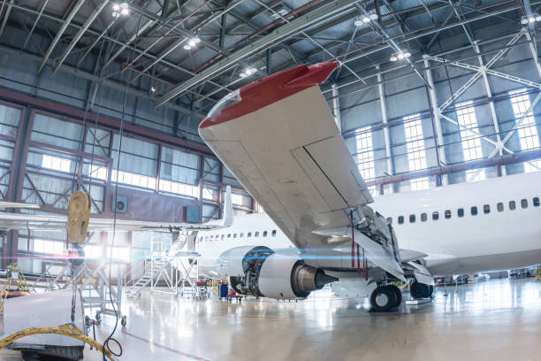 istock White passenger aircraft in the aviation hangar 1869173904