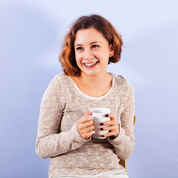 istock Girl enjoying a hot drink 186917911