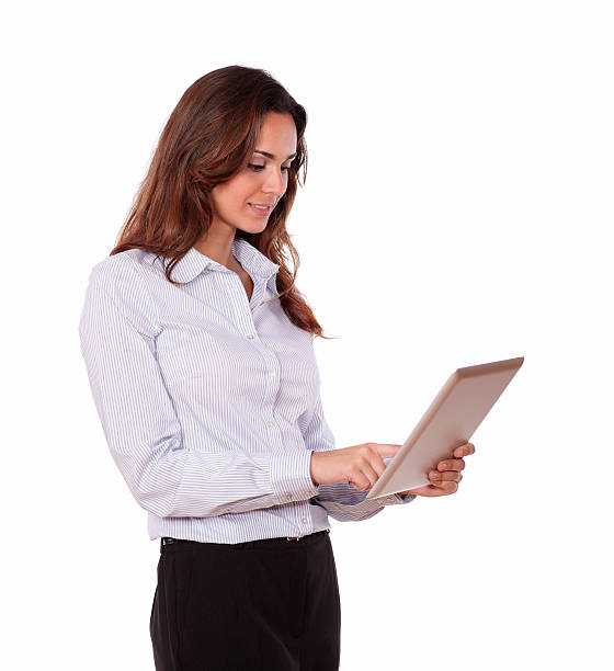 istock Charming young woman working on tablet pc 186918386