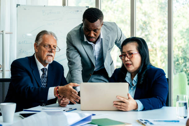 istock Team of entrepreneurs working on business progress 1869185512