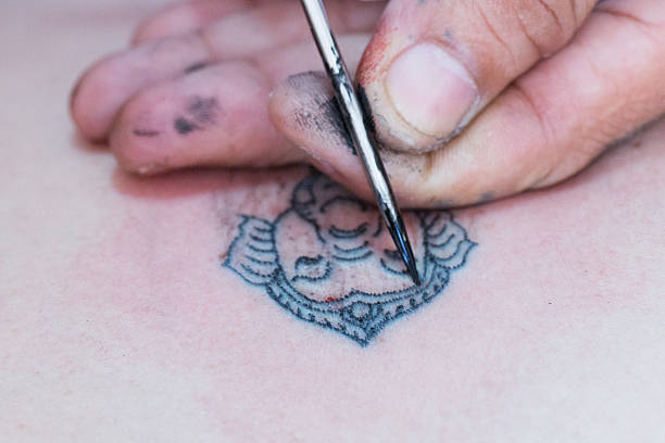 Yantra Tattooing Thailand, close up of traditional style of making tatoo