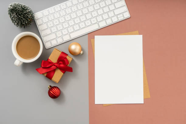 istock Christmas and New Year background with Computer keyboard, Empty paper blank and Christmas decorations, Top view. 1869192920
