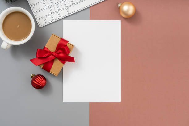 istock Christmas and New Year background with Computer keyboard, Empty paper blank and Christmas decorations, Top view. 1869192921