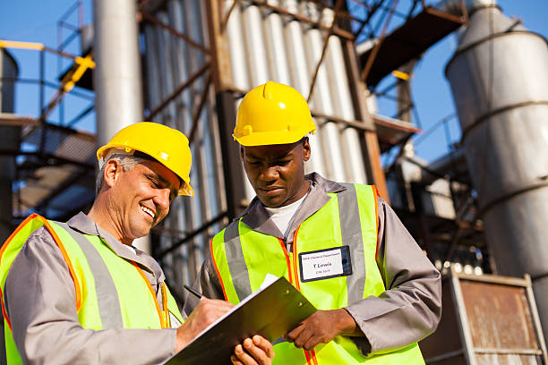 istock petrochemical co-workers working at plant 186919548