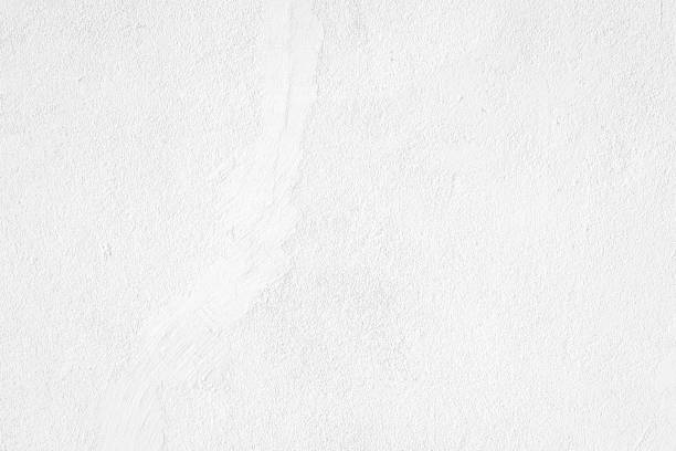 istock White concrete wall texture. White concrete wall background. White concrete wall texture 1869198166
