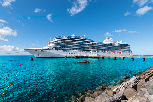 Roseau, Dominica - November 24, 2023: Side view of beautiful cruise ship Oceania Cruises Vista in port of Roseau, Dominica.