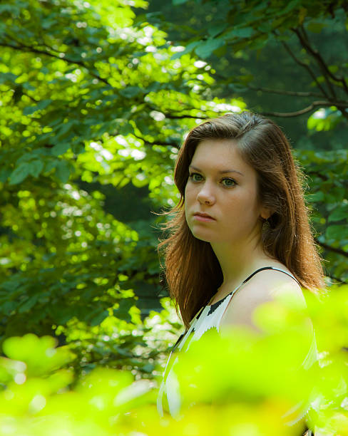 istock young female model outside in a park 186920654