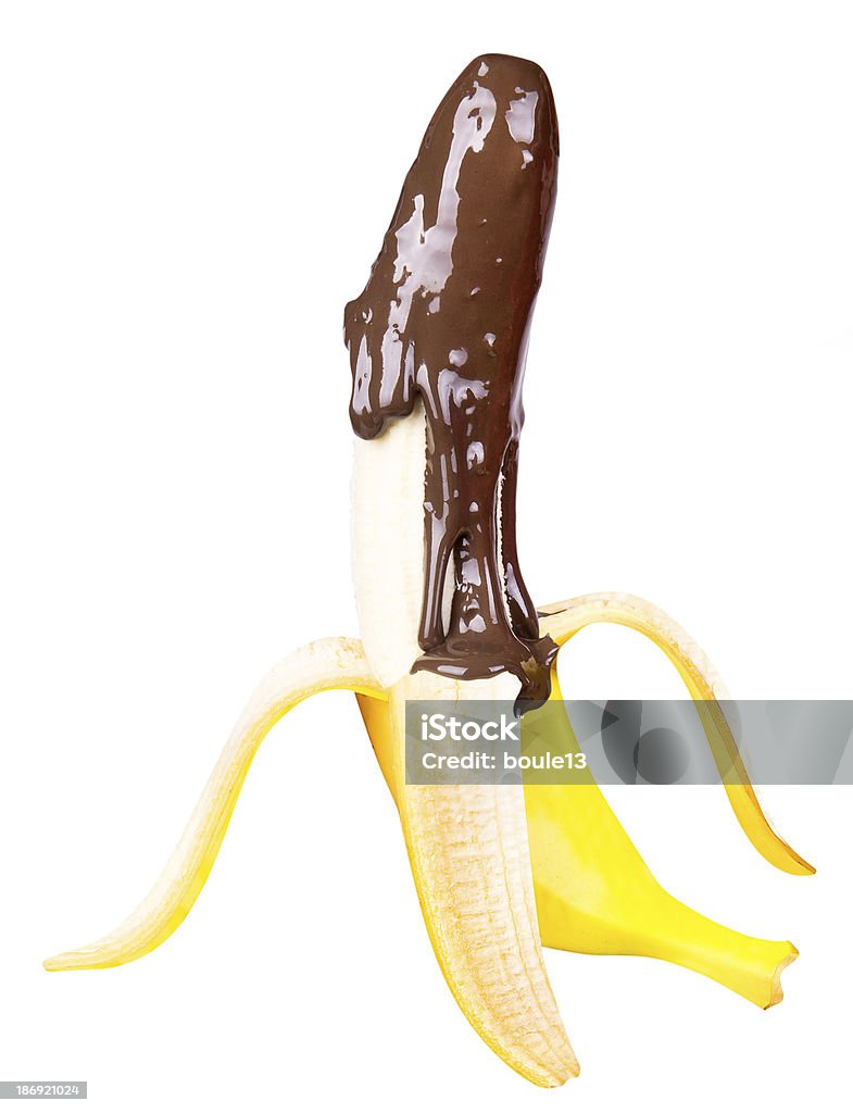 Banana poured with liquid chocolate Banana poured with liquid chocolate isolated on white Banana Stock Photo