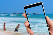 Ocean waves on smartphone screen.