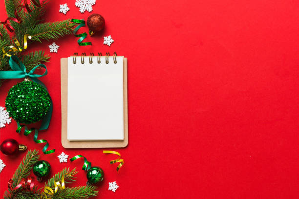 istock Christmas blank greeting card mock-up scene. Creative layout made of Christmas tree branches and paper card note. Flat lay. Nature New Year concept 1869214466