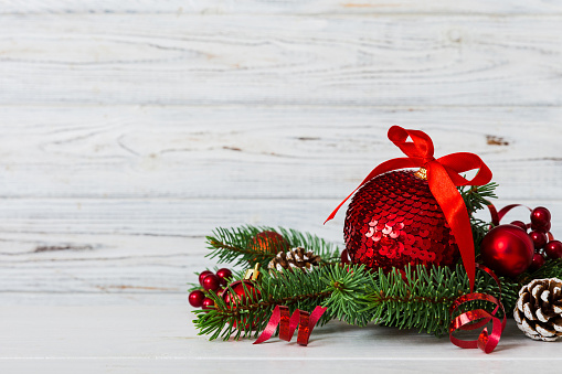 New Year Christmas tree toy, branches of a christmas tree, New Year decorations on a colored background.