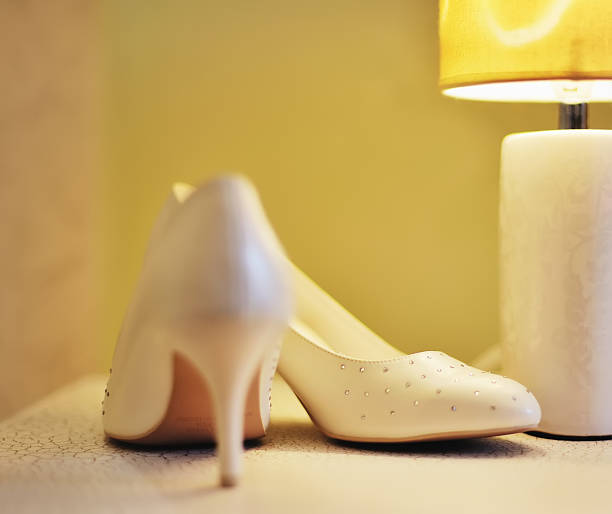 istock wedding day shoes in hotel room 186921528