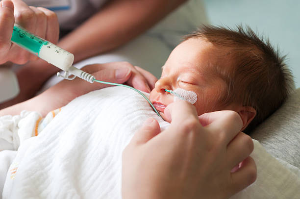 Newborn baby in incubator Newborn baby in incubator premature stock pictures, royalty-free photos & images