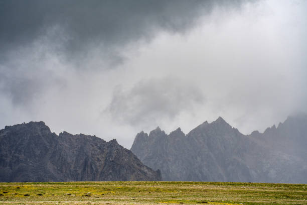 istock Grasslands and Mountains in the Cloudy Plateau 1869227156