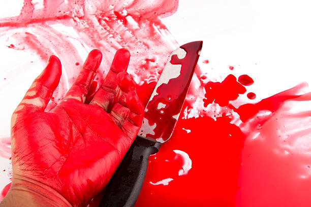 Halloween concept : Bloody knife with blood splatter