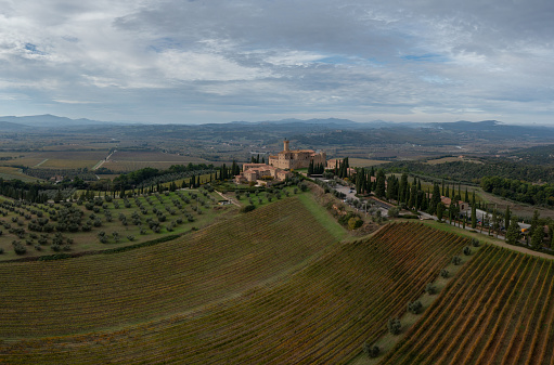 Montalcino, Italy - 16 November, 2023: aerial view of the Poggio alle Mura Castle and Villa Banfi wine resort in Tuscany