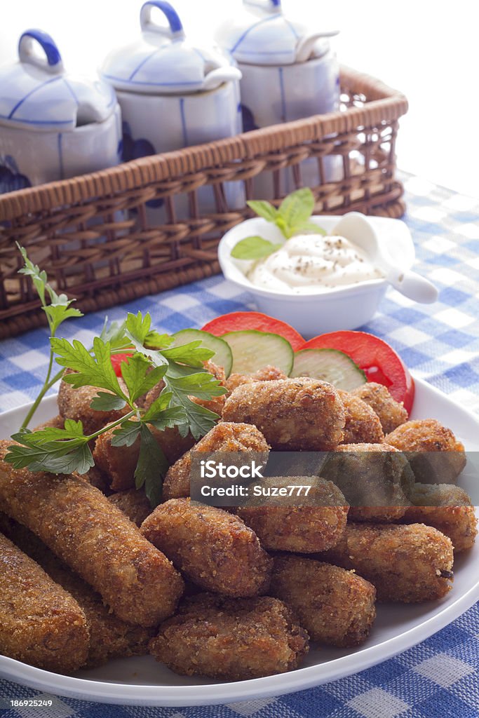 Croquettes on a plate Croquettes on a plate. Decorated with vegetables Breaded Stock Photo