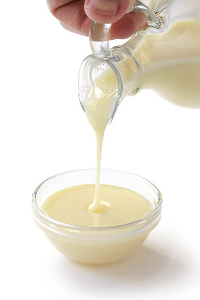 istock Condensed milk being poured from a jar into a bowl 186925989