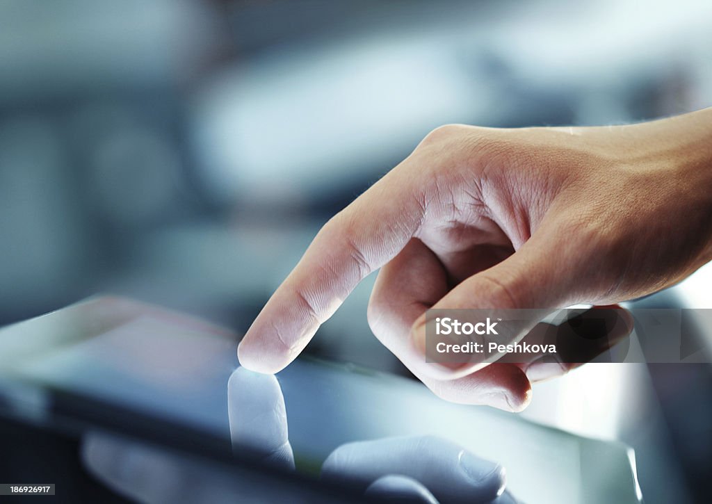 tablet in hand businessman holding digital tablet, closeup Computer Monitor Stock Photo