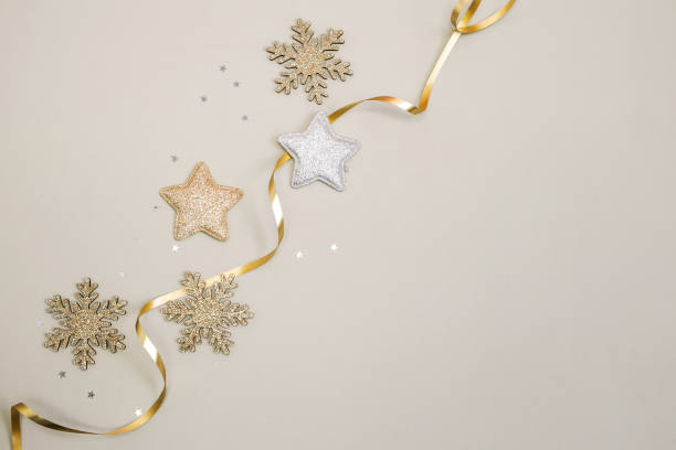 istock Christmas gold ornaments on a monochrome background. Top view. 1869273896