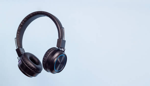istock Black headphones on a blue background. Minimal concept. 1869275505