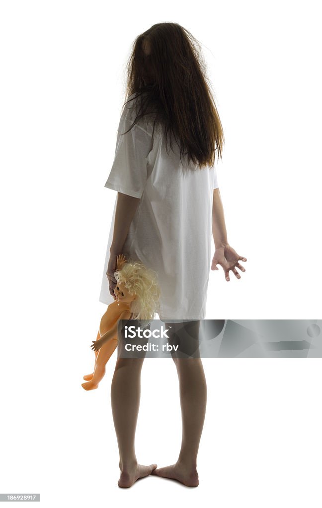 Zombie girl with doll Zombie girl with doll isolated Rear View Stock Photo