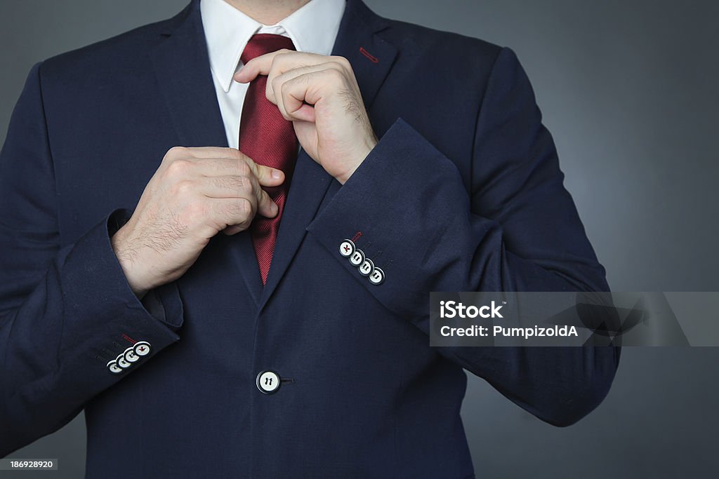 hands un blue backgroung with blue business suit Adult Stock Photo