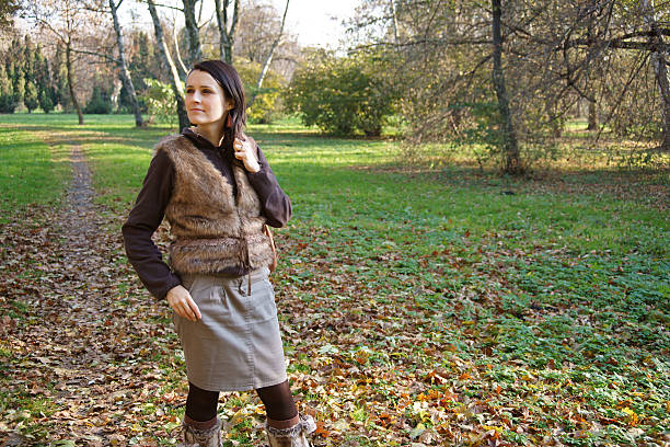 Woman in autumn park stock photo