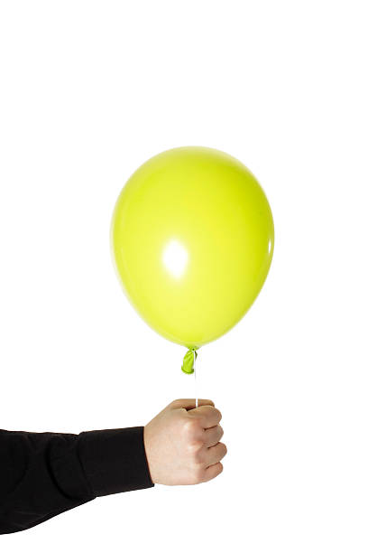 istock man holding yellow baloonn isolated 186929998