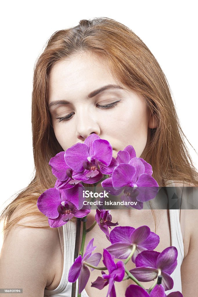 Ragazza con orchidee - Foto stock royalty-free di Adulto