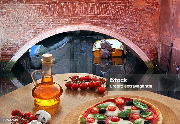 Classic Italian Pizza In Venice Against Canal Italy Stock Photo - Download Image Now