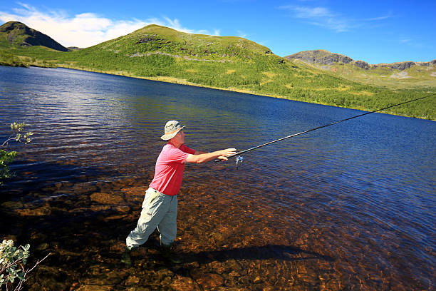 istock fisherman turns the lure out 186932392