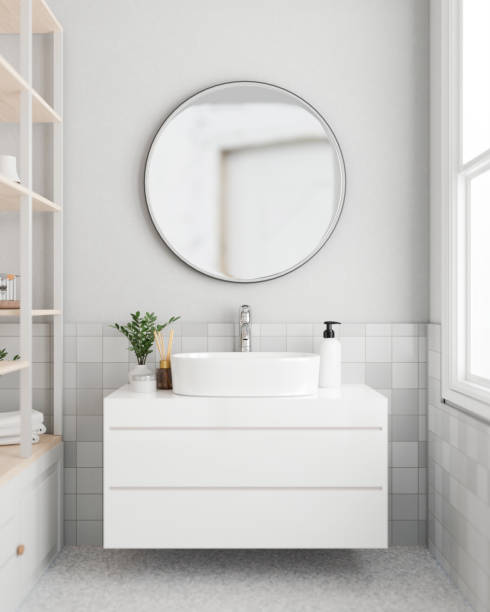 istock A modern white bathroom with a circle mirror on the white wall, a modern white bathroom sanity sink. 1869334262