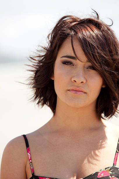 istock Beautiful brunette at beach 186933932